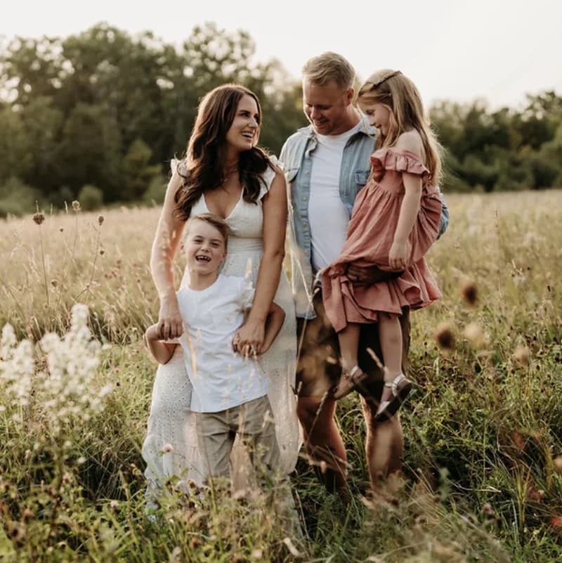Sarah and her family in a wildflower field